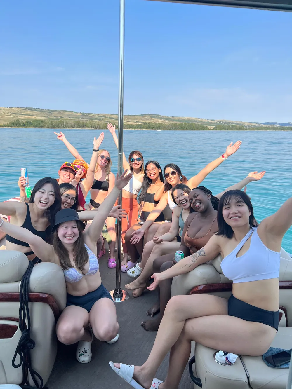 A full boat of guests cheering at the camera