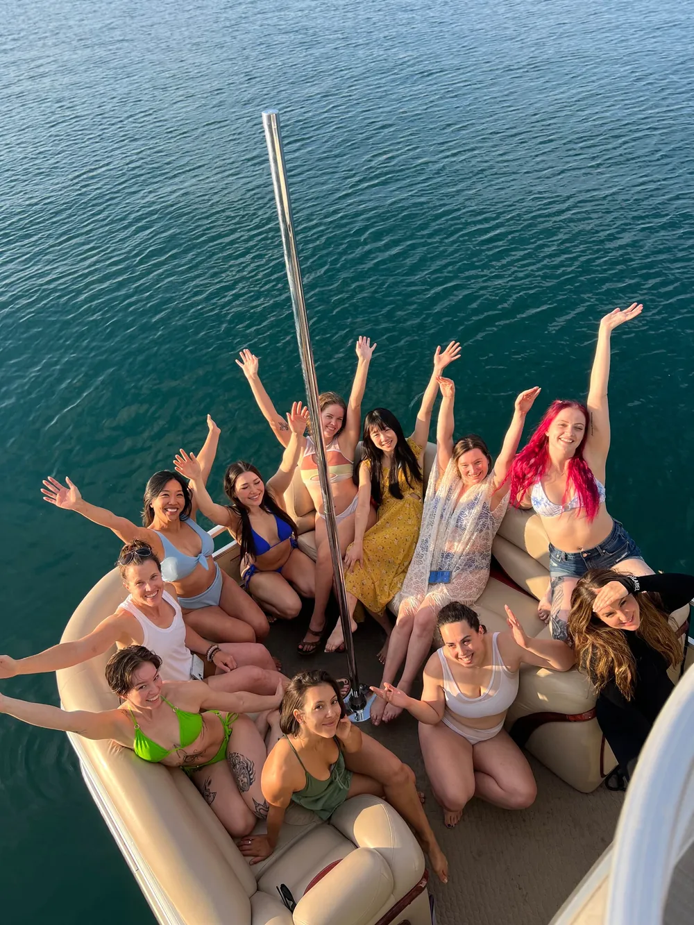 A full boat of guests with their arms raised