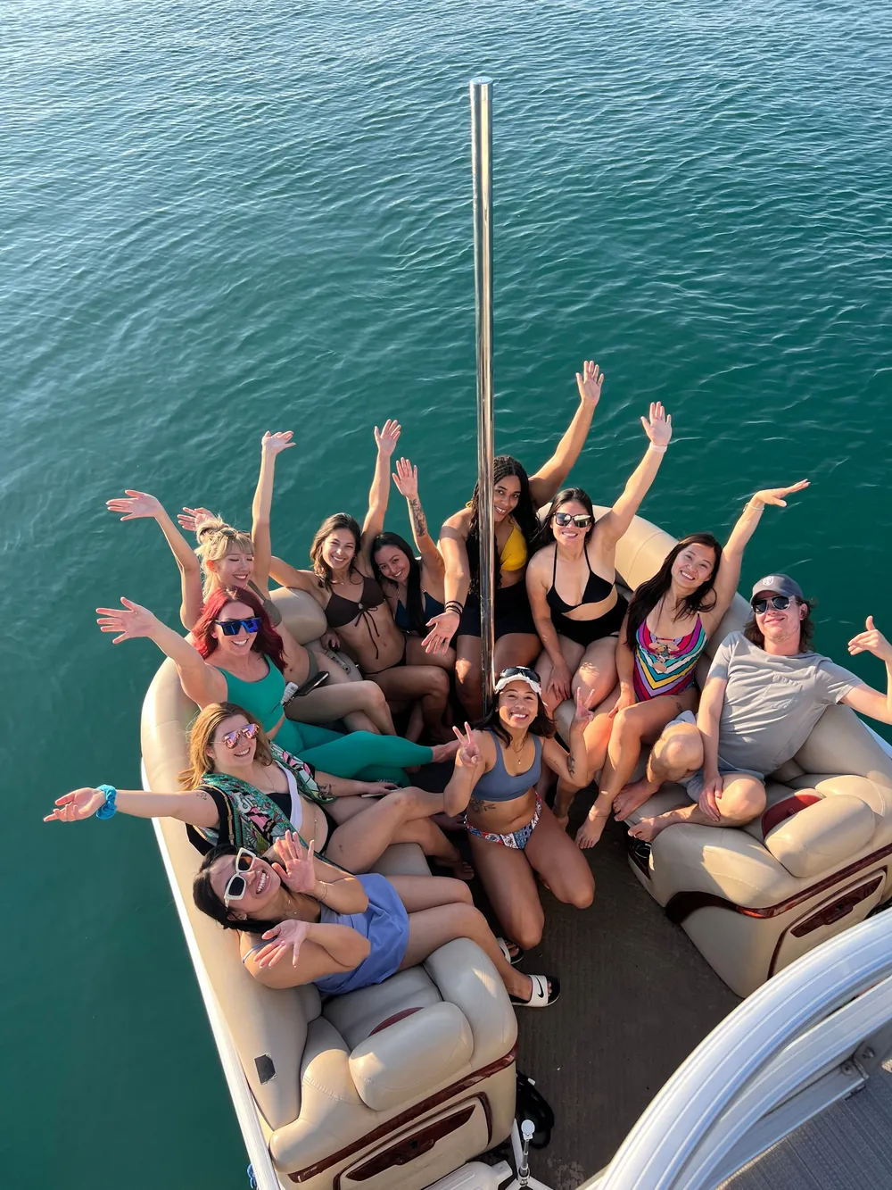 The group gathered across the boat's seating